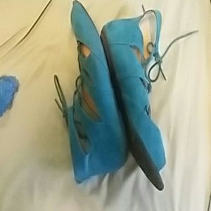 Teal gladiator sandals.